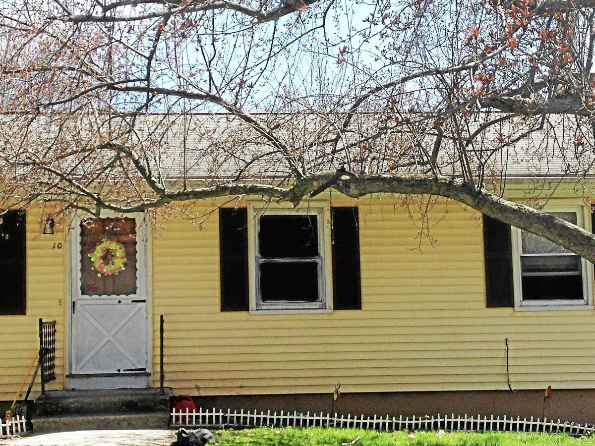 A blacked-out window is seen Friday at the Seymour house where a man is accused of holding his sister captive in squalor for years.