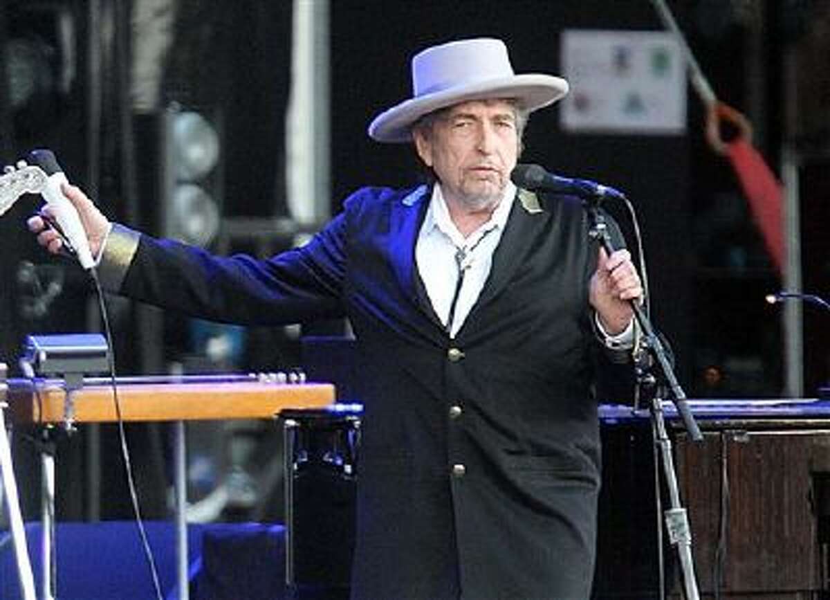 This July 22, 2012 file photo shows U.S. singer-songwriter Bob Dylan performing on stage at "Les Vieilles Charrues" Festival in Carhaix, western France.