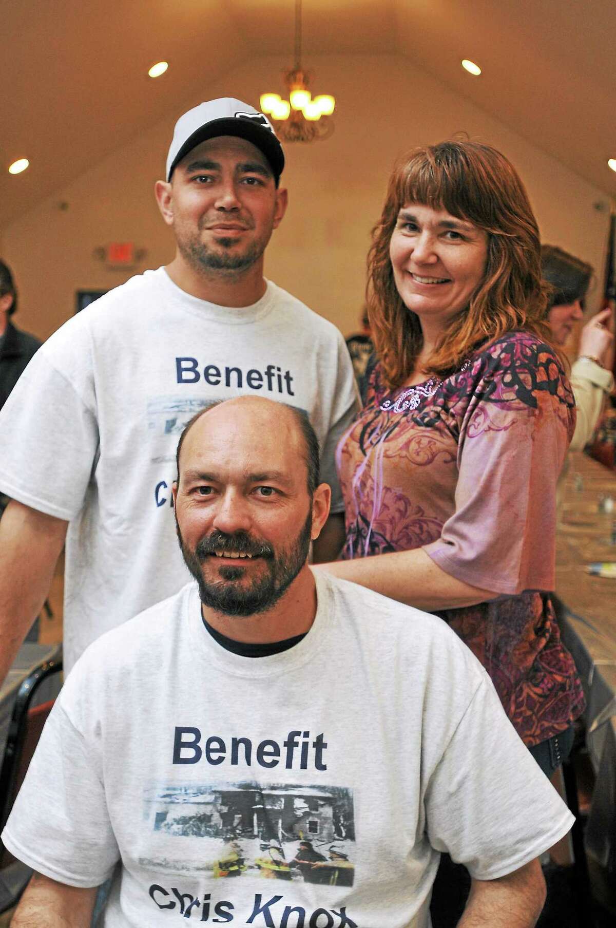 Christopher Knox, front, with Russell Melius and Deanne Knox Fredsall during a fundraiser for Knox Saturday at the Winsted VFW Post 296.
