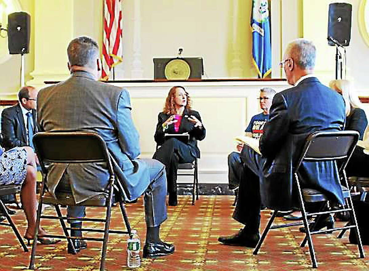 U.S. Rep. Elizabeth Esty addresses mental health, medical and law enforcement professionals from around the state in Waterbury City Hall Thursday during a discussion on the stateís rising heroin problem. Lindsay Boyle ó Special to The Register Citizen
