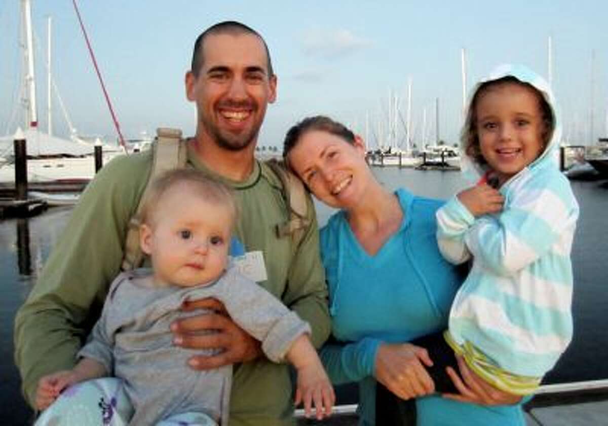 This undated image provided by Sariah English shows Eric and Charlotte Kaufman with their daughters, Lyra, 1, and Cora, 3. Rescuers have stabilized the condition Lyra, with her family on a crippled sailboat hundreds of miles off the coast of Mexico, and a U.S. Navy warship was headed toward the vessel, officials said Friday night, April 4, 2014. Their boat, the 36-foot Rebel Heart, was about 900 nautical miles southwest of Cabo San Lucas when they sent a satellite call for help to the U.S. Coast Guard Thursday morning saying their 1-year-old girl aboard was ill. (AP Photo/Sariah English)
