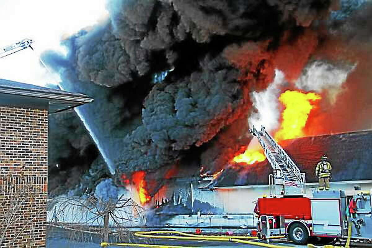 The scene of a five-alarm fire at the Toce Brothers Inc. tire warehouse Thursday morning in Torrington. Esteban L. Hernandez ó Register Citizen