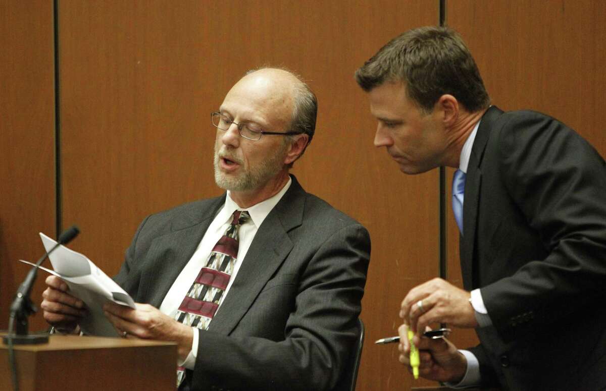Robert William Johnson, who works for a medical equipment company, confers with Deputy District Attorney David Walgren while testifying at the Conrad Murray involuntary manslaughter trial in downtown Los Angeles, Friday, Sept. 30, 2011. Murray has pleaded not guilty and faces four years in prison and the loss of his medical license if convicted of involuntary manslaughter in Michael Jackson's death. (AP Photo/Al Seib, Pool)