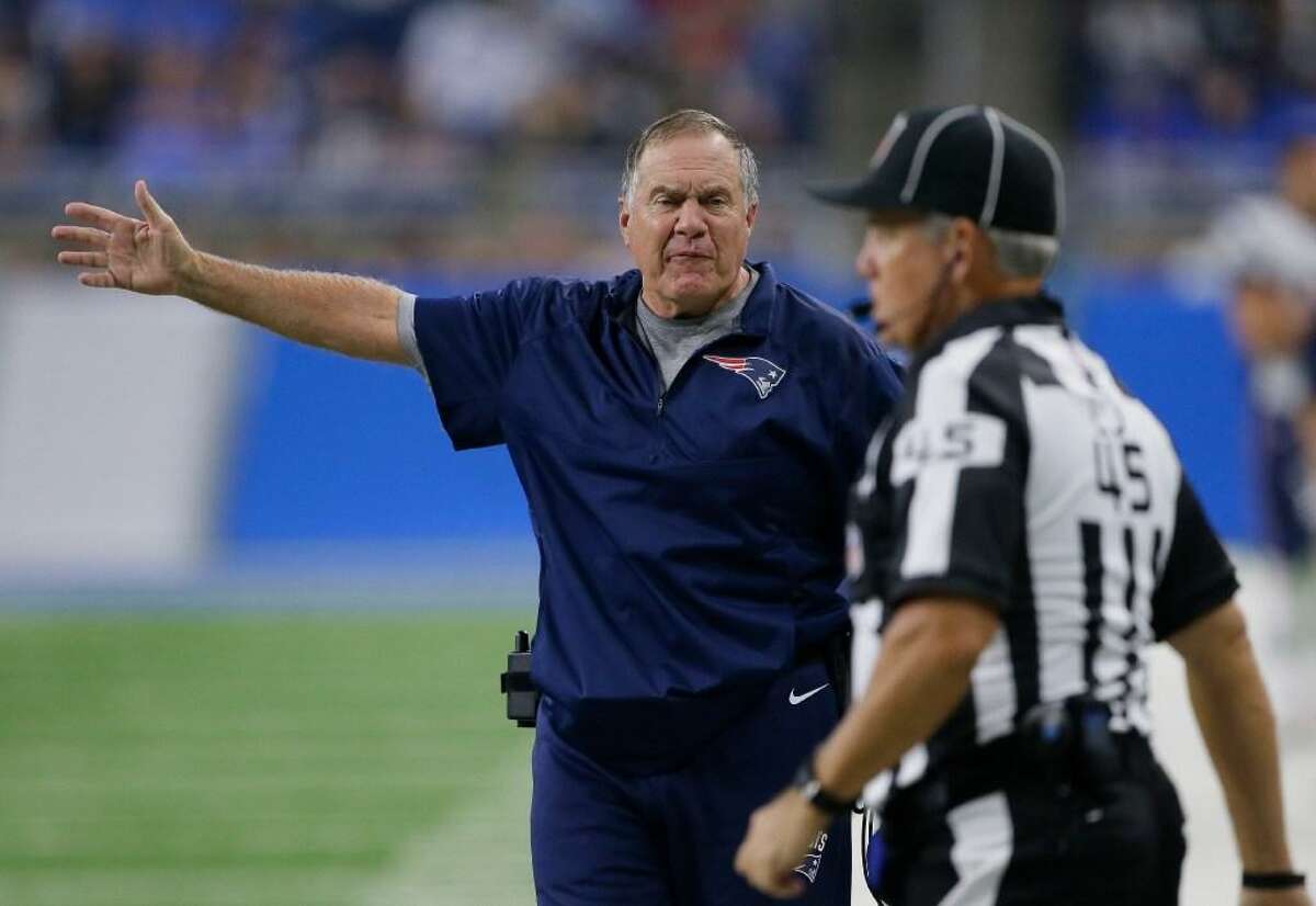 New England Patriots head coach Bill Belichick argues a call with line judge Jeff Seeman (45) during the second half of a preseason game at Detroit on Aug. 25, 2017.
