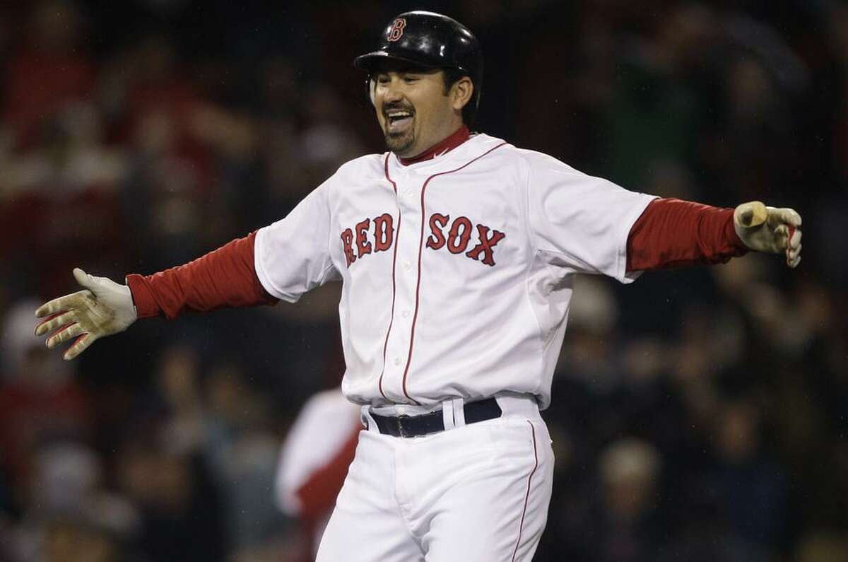Boston Red Sox's Adrian Gonzalez celebrates after his game-winning, two-run double against the Baltimore Orioles in the ninth inning of a baseball game at Fenway Park in Boston, Monday, May 16, 2011. The Red Sox won 8-7. (AP Photo/Charles Krupa)