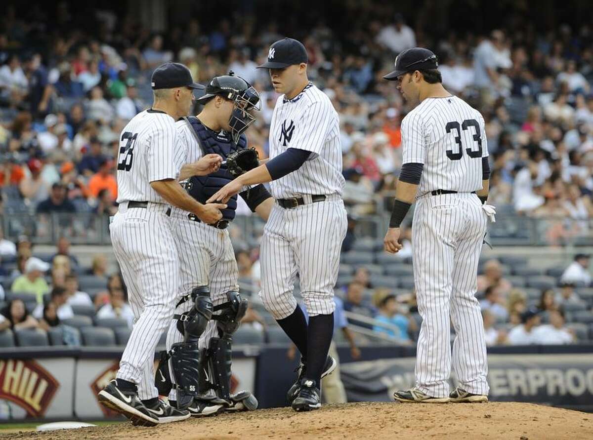 New York Yankees Outfielder Nick Swisher (#33) gets a hit. The