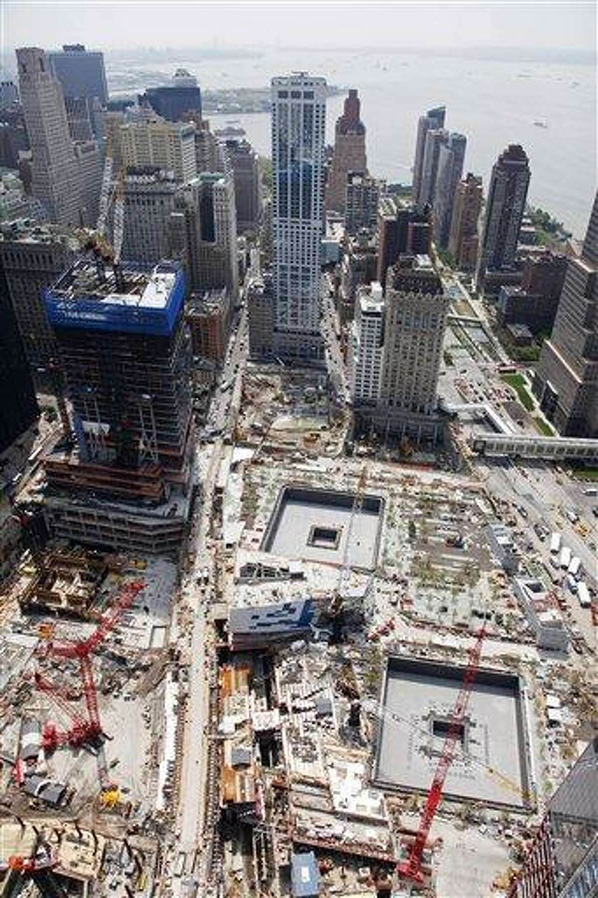 The National September 11 Memorial and Museum is under construction, lower right, Tuesday, May 3, 2011 at the World Trade Center site in New York. President Barack Obama will meet at the memorial Thursday with families of victims of the September 11, 2001 attacks following the death of Osama bin Laden on Sunday in Pakistan. The memorial is scheduled to open to the public in time for the tenth anniversary to be held Sept. 11, 2011. (AP Photo/Mark Lennihan)