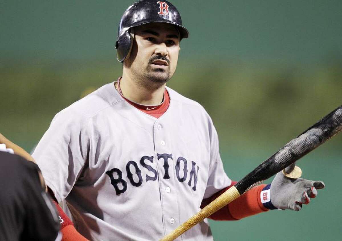 ASSOCIATED PRESS Boston's Adrian Gonzalez walks back to the dugout after striking out against Pittsburgh Pirates closer Joel Hanrahan to end an interleague game in Pittsburgh Saturday. The Red Sox lost 6-4.