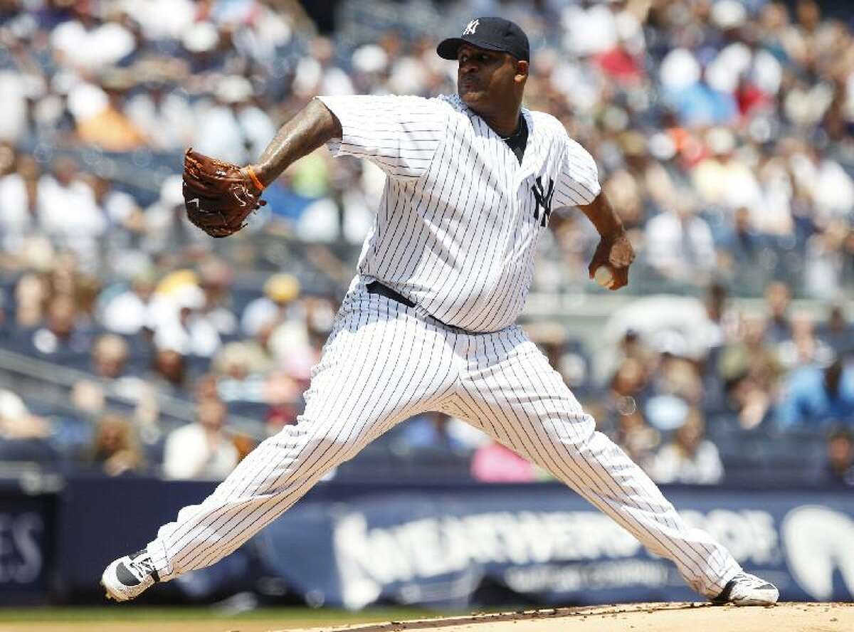 New York Yankees starting pitcher CC Sabathia delivers in the