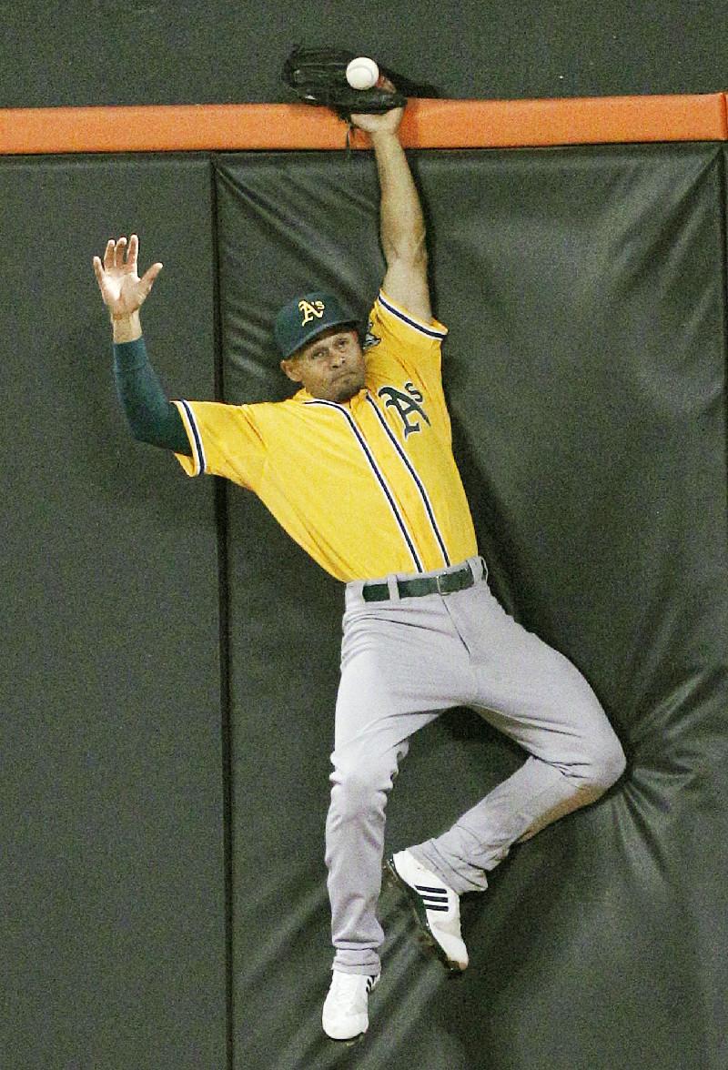 Oakland Athletics' Coco Crisp jogs in at batting practice during a