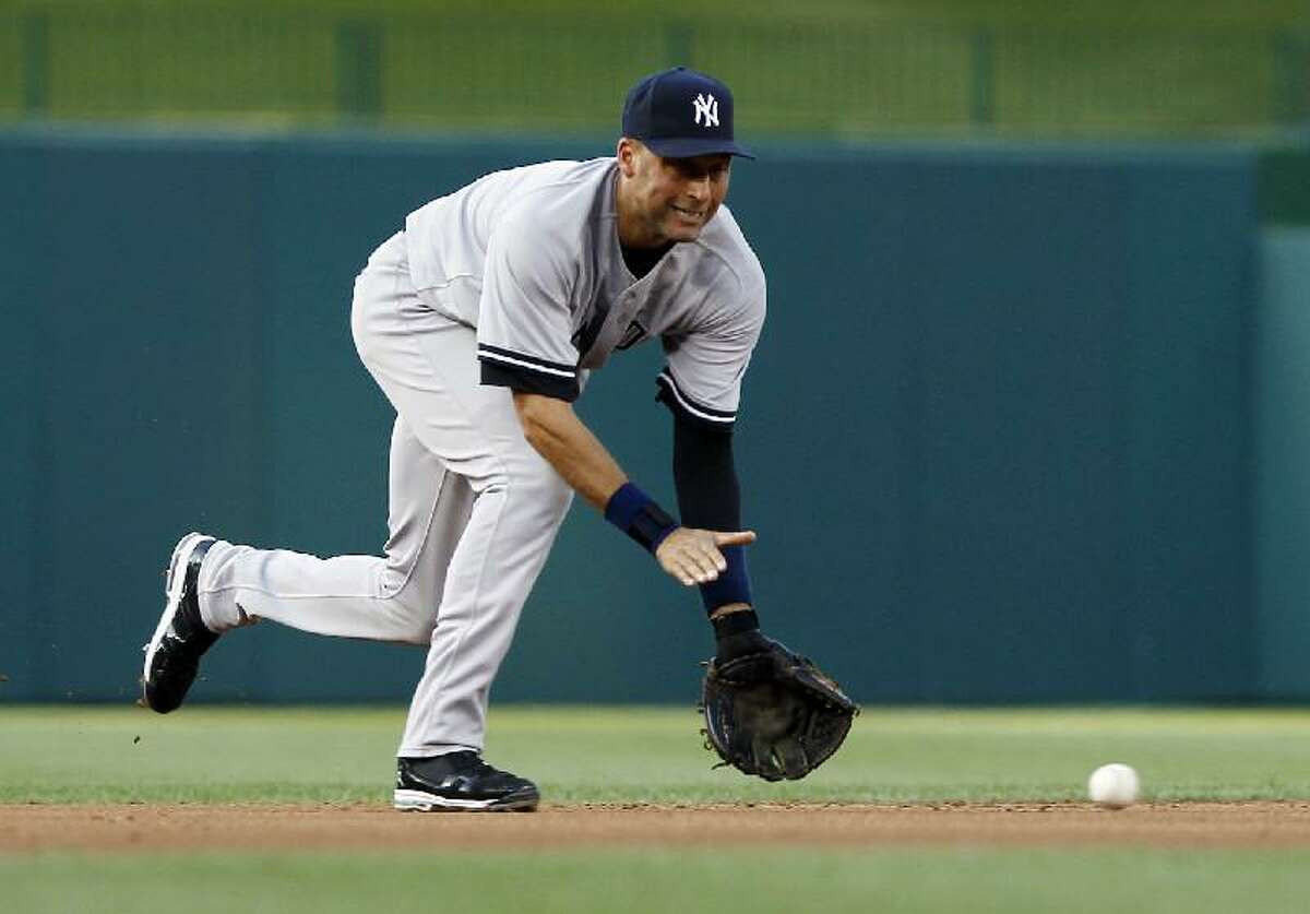 New York Yankees shortstop Derek Jeter (2) fields a ground ball as