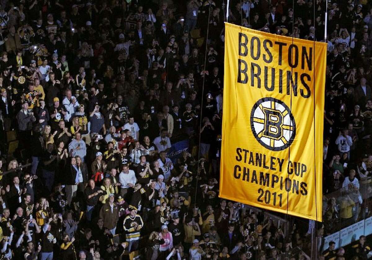 ASSOCIATED PRESS Fans applaud as the Stanley Cup banner is hoisted to the rafters of the Boston Garden prior to the Boston Bruins facing the Philadelphia Flyers in a game Thursday in Boston.