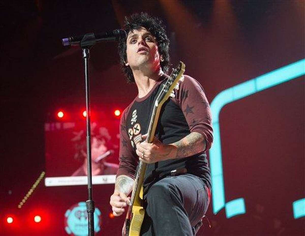 This Sept. 21, file photo released by Clear Channel shows Billie Joe Armstrong of Green Day performing at the 2012 iHeartRadio Music Festival at the MGM Grand Garden Arena in Las Vegas, Nev. Green Day has canceled its upcoming performance in New Orleans. The band was scheduled to headline the Voodoo Music + Arts Experience at City Park on Oct. 27 but a spokesman for the group announced Tuesday the performance was being canceled. The announcement comes less than a month after the band's front man Billie Joe Armstrong headed into treatment for substance abuse. ASSOCIATED PRESS PHOTO