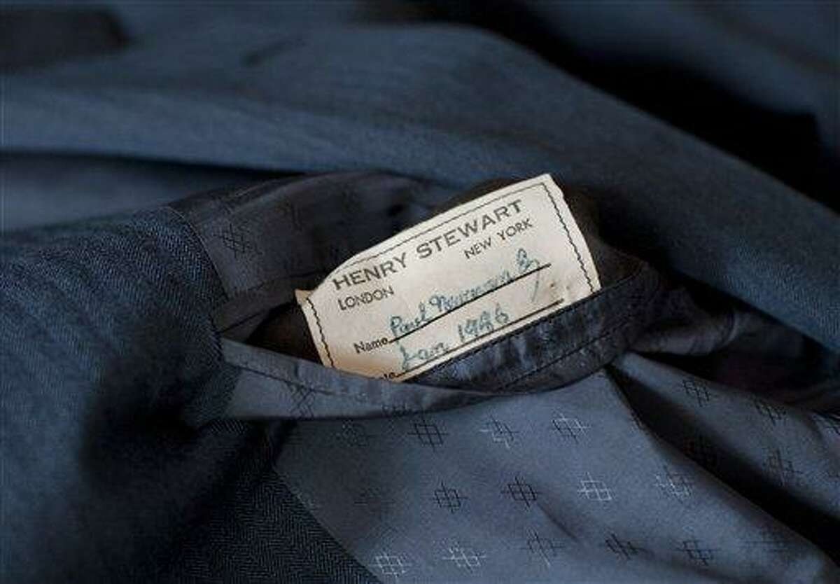 A tailor's tag with the name "Paul Newman" is seen on a suit found by Peter Gamlen in the basement of his apartment in New Haven, Conn., Tuesday, Oct. 9. Gamlen believes the suit belonged to the actor. ASSOCIATED PRESS PHOTO