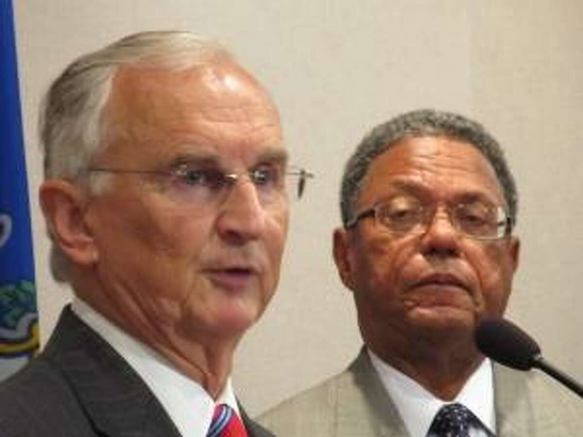 Photo courtesy of ctmirror.org Robert A. Kennedy (left), president of the Board of Regents, and Lewis Robinson Jr., chairman of the board.