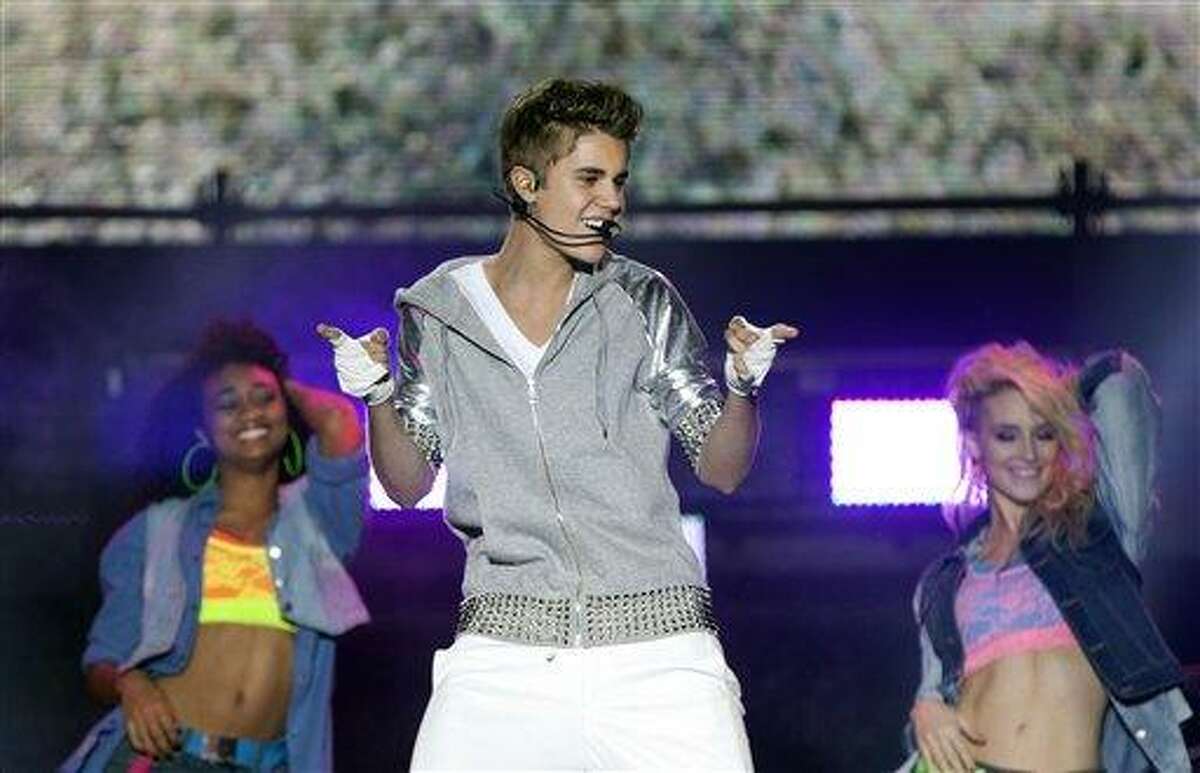 Pop star Justin Bieber, front, performs during a free open-air concert in Mexico City, Monday.