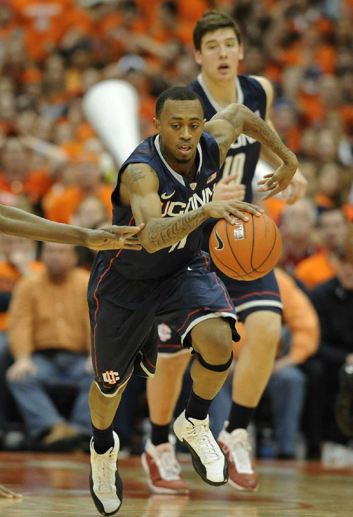 ASSOCIATED PRESS Connecticut's Ryan Boatright dribbles down the court during Saturday's game against Syracuse at the Carrier Dome in Syracuse, N.Y. The Huskies lost 85-67.