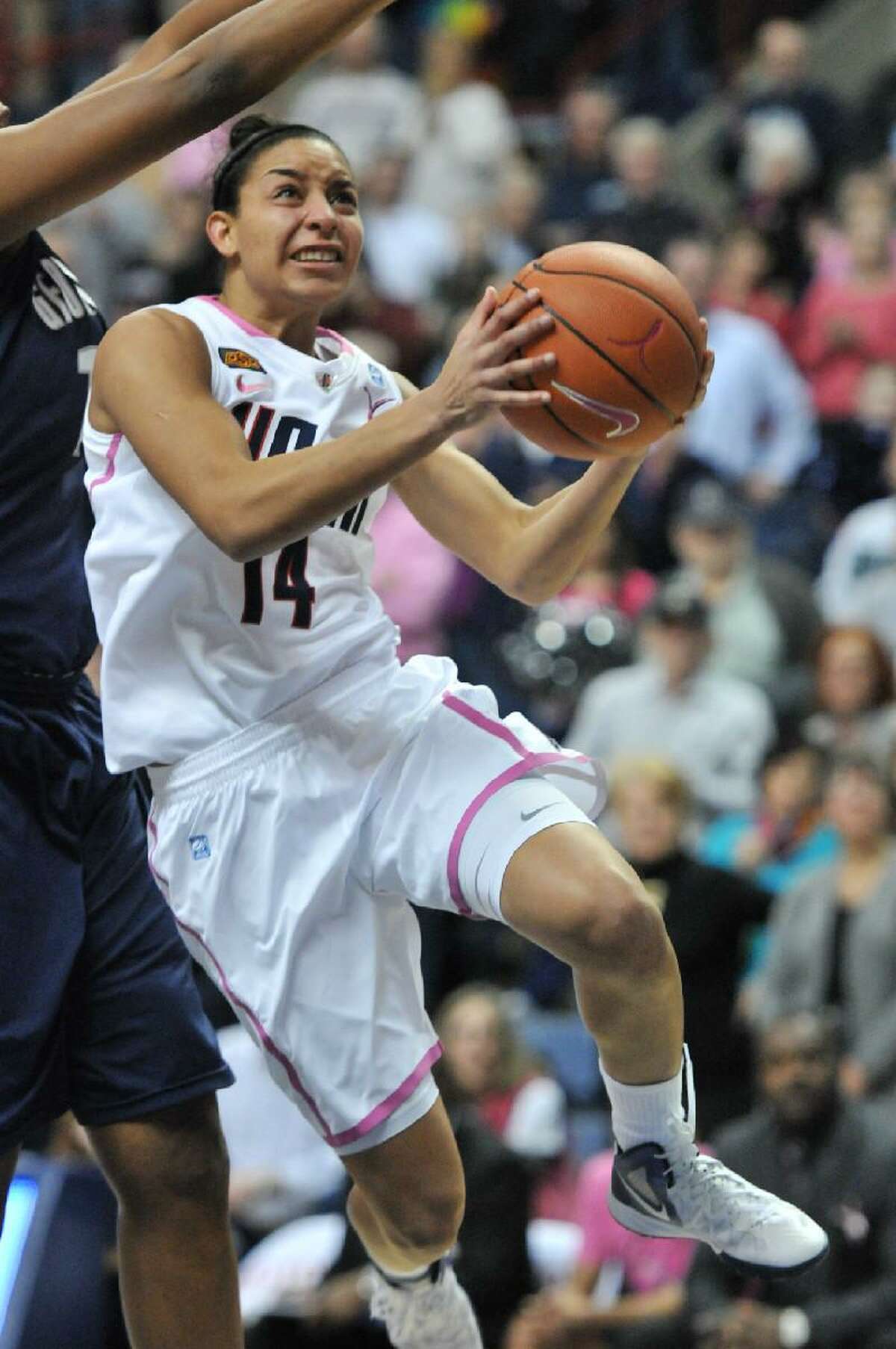 ASSOCIATED PRESS Connecticut's Bria Hartley makes her move to the basket during Saturday's game against Georgetown at Gampel Pavilion in Storrs. The Huskies won 80-38 to extend their home winning streak to 99 straight homes.