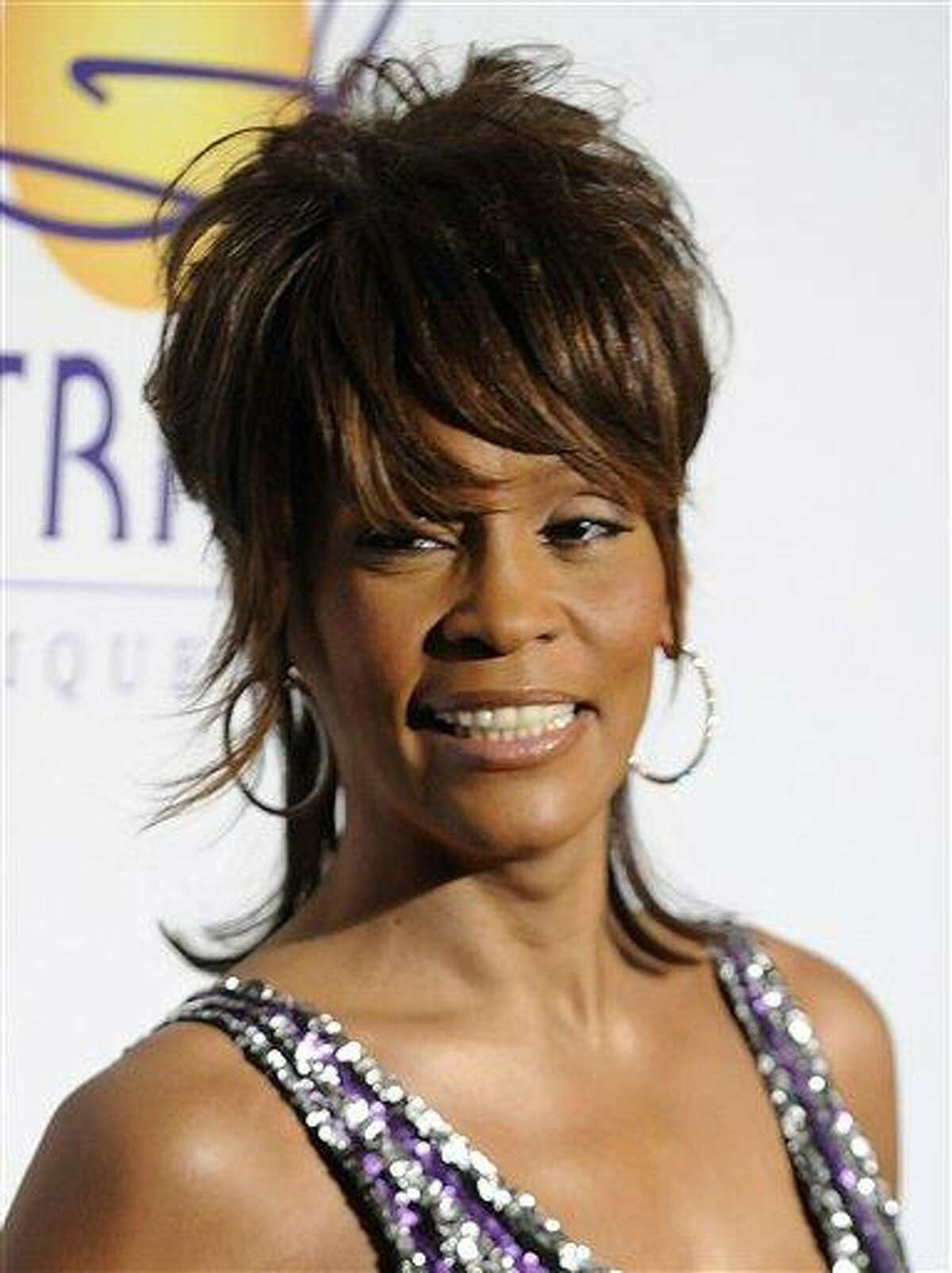 FILE - In this Feb. 9, 2008 file photo, singer Whitney Houston arrives at the Clive Davis Pre-Grammy Party in Beverly Hills, Calif. Whitney Houston, who reigned as pop music's queen until her majestic voice and regal image were ravaged by drug use, has died, Saturday, Feb. 11, 2012. She was 48. (AP Photo/Chris Pizzello, file)