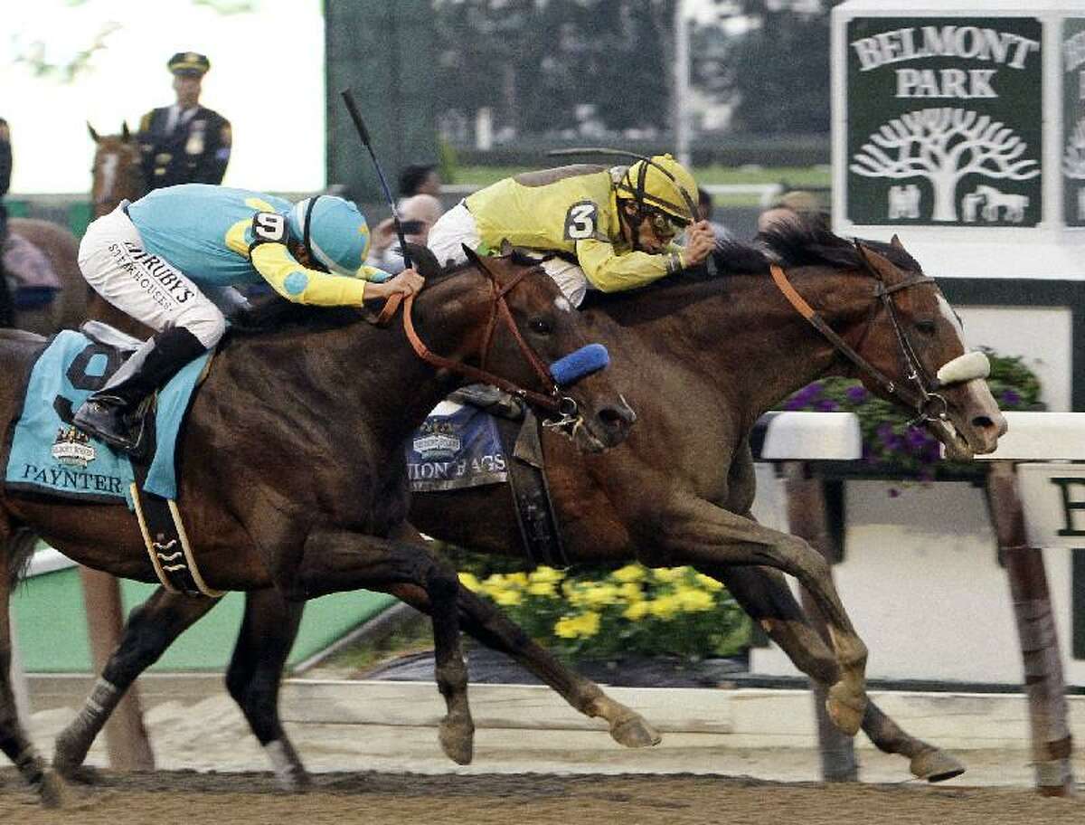 ASSOCIATED PRESS Jockey John Velazquez, right, drives Union Rags past Paynter and jockey Mike Smith, left, to the finish line for victory in the Belmont Stakes horse race at Belmont Park in Elmont, N.Y., Saturday.