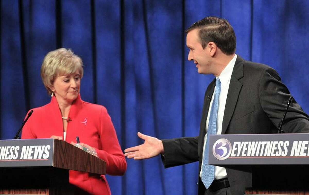 Linda McMahon seems to think twice about accepting a handshake from Chris Murphy after their fiery debate. This was the first meeting of the two in the battle for the U.S. Senate seat being vacated by Joe Joe Lieberman, who is retiring. Photo Peter Casolino/New Haven Register