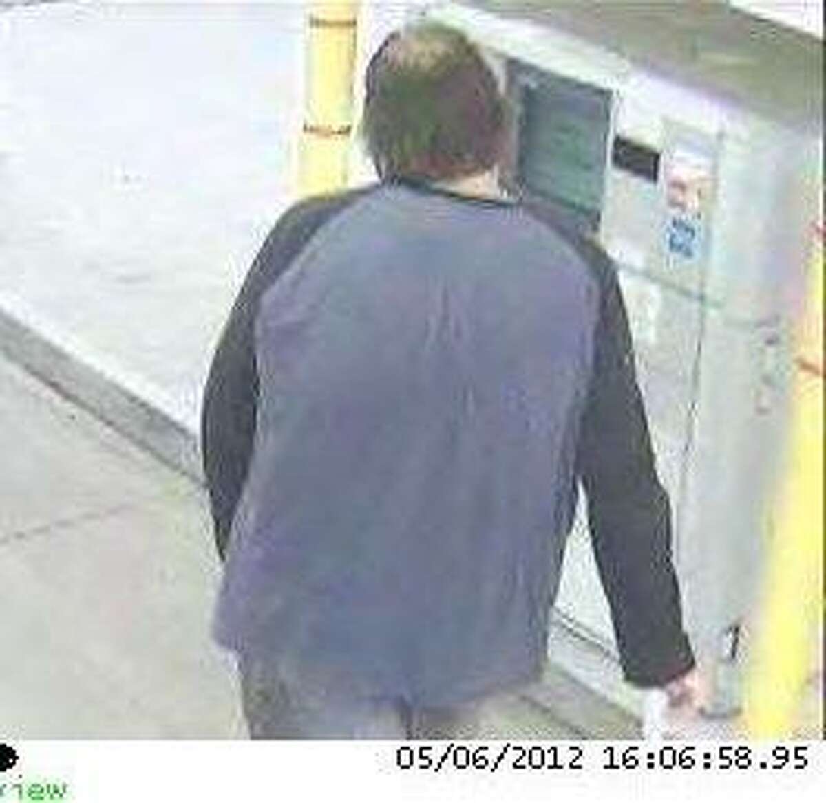 A rear shot of the suspect with the heavier build.