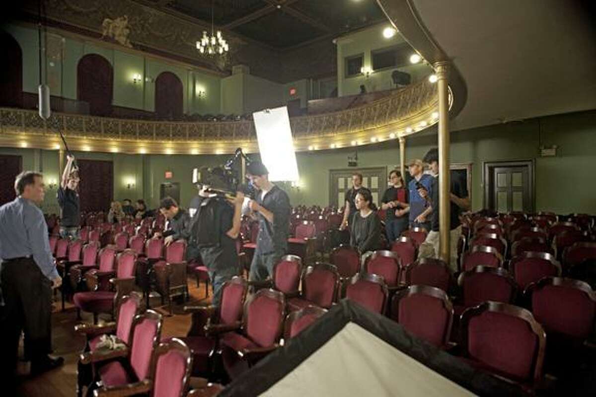 The crew of "Escape Act" prepares lighting and camera for a scene in the Thomaston Opera House. (Contributed photo)