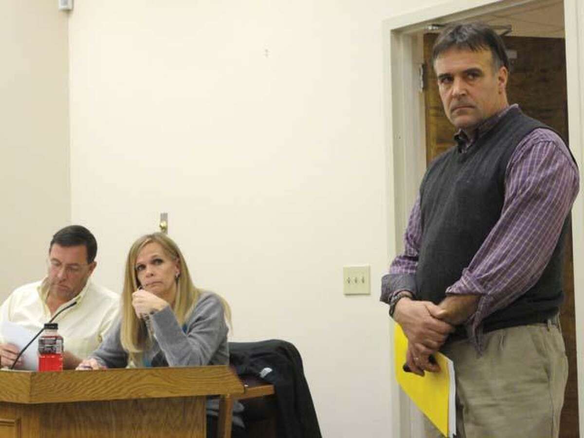 JASON SIEDZIK/ Register CitizenWinchester Land Trust board member Jay Martin, right, made his case for the trust's revised plan to purchase easements to the Board of Selectmen. However, Lisa Smith, second from left, voted along with Ken Fracasso, left, and the other Republicans against the plan, which failed 4-3.
