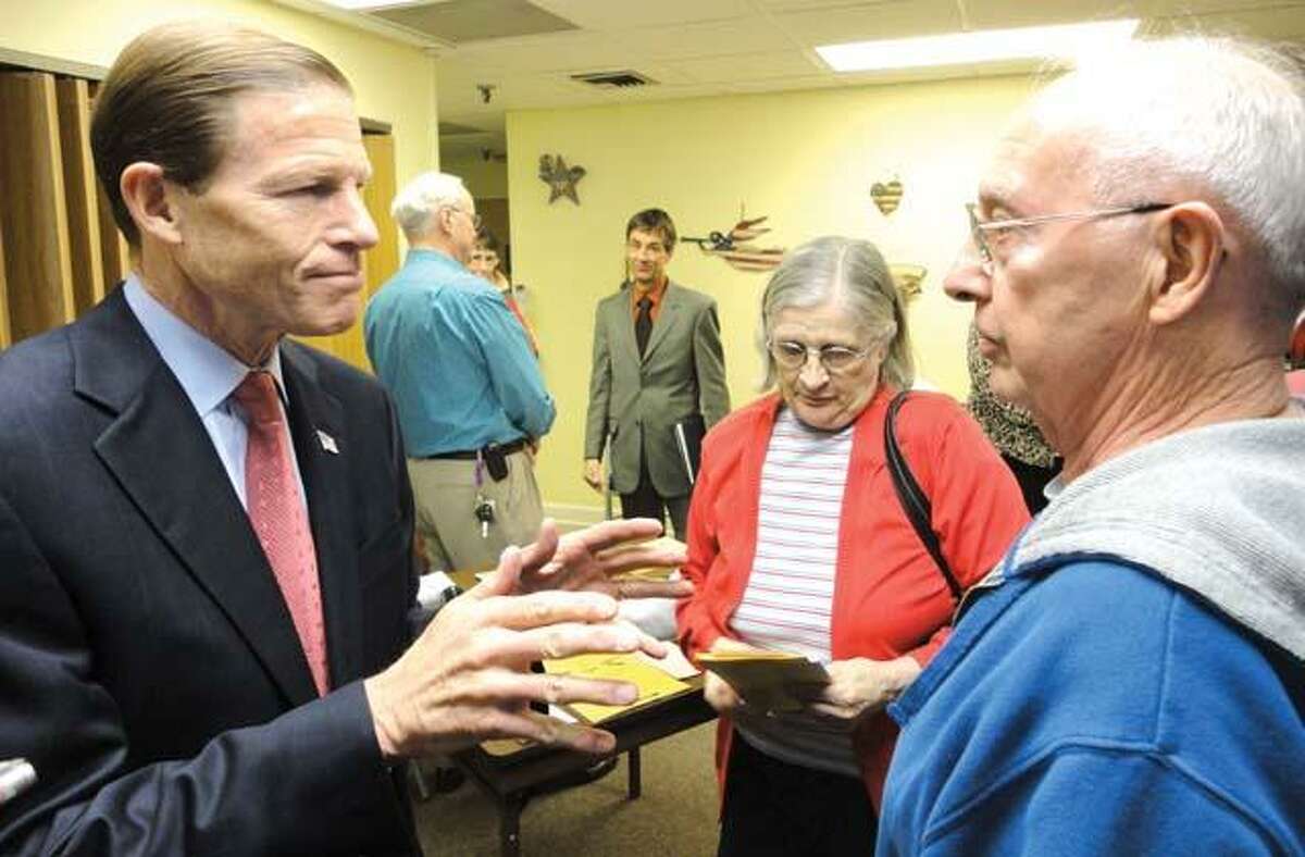 JASON SIEDZIK/ Register CitizenSen. Richard Blumenthal speaks with a Winsted resident concerned about state employee pensions. The former Attorney General met with seniors to discuss scams, as well as Social Security and other issues.