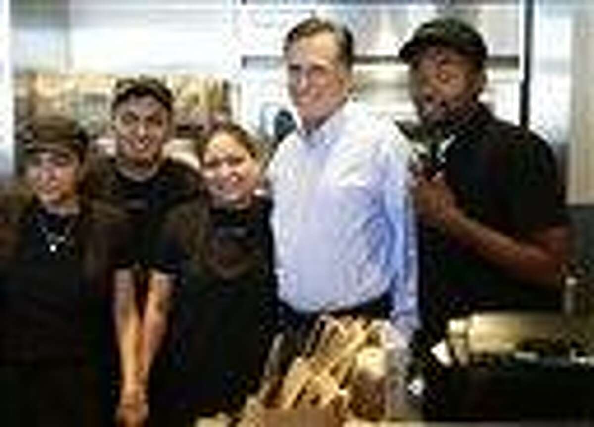 Republican presidential candidate Mitt Romney poses for a photo that unexpectedly went viral. AP Photo