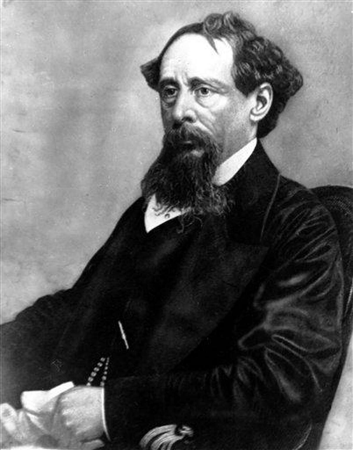 In this undated file photo, novelist Charles Dickens poses for a photograph. Britain's Prince Charles will lay a wreath Tuesday on the writer's grave in Westminster Abbey's Poet's Corner to mark his 200th of birthday. Associated Press
