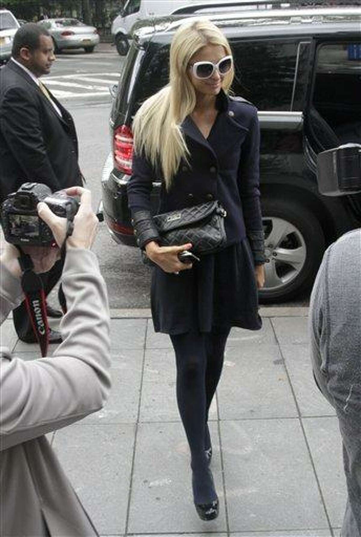 Paris Hilton arrives at federal court in lower Manhattan on Monday, June 4, 2012, in New York. Hilton was in court for settlement talks with an Italian designer that sued her over a licencing agreement to market lingerie under her name. The suit, for unspecified damages, alleges Hilton hurt business by not approving design concepts in a timely manner.