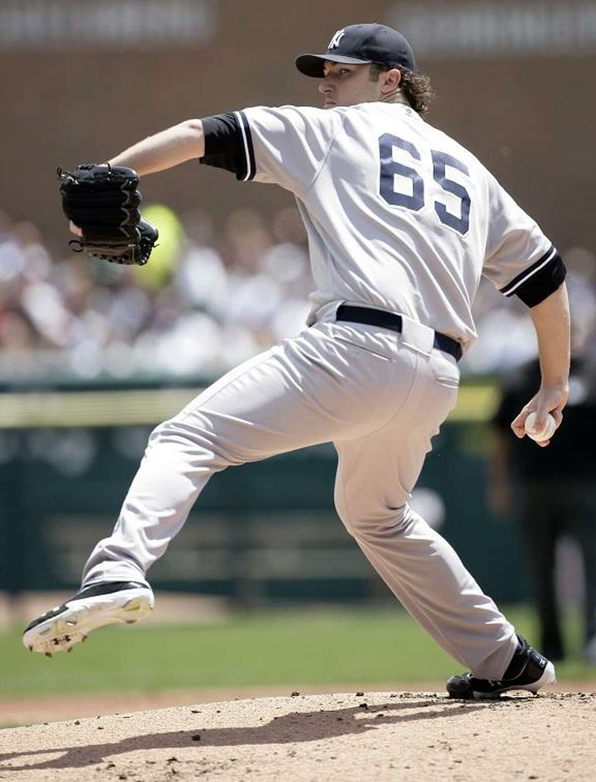 New York Yankees starter Phil Hughes pitches against the Detroit Tigers in the first inning of baseball game on Sunday, June 3, 2012, in Detroit. (AP Photo/Duane Burleson)