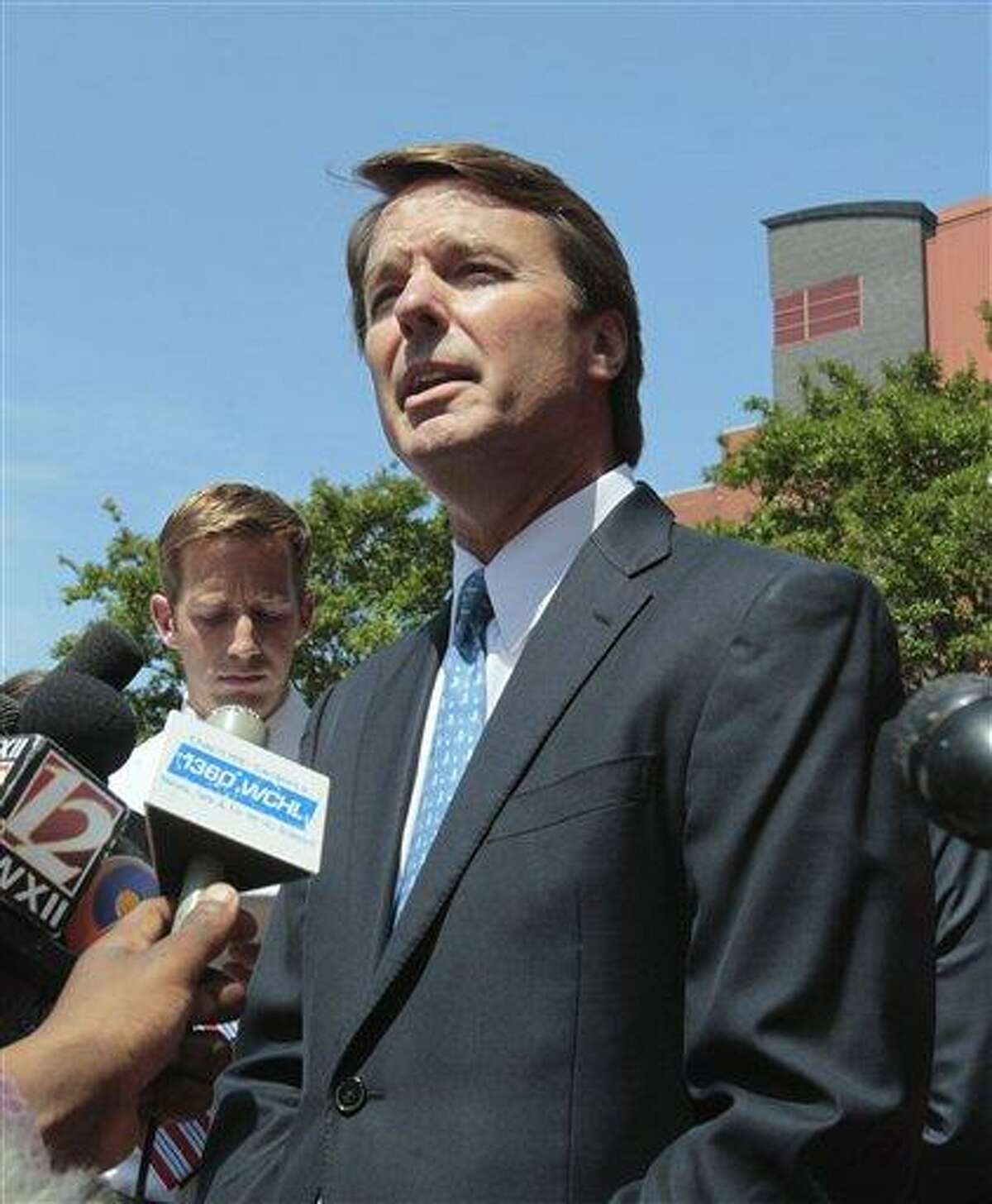 FILE - In this June 3, 2011 file photo, former presidential candidate John Edwards outside federal court appearance in Winston-Salem, N.C. Prosecutors have obtained emails between John Edwards and a former aide to use as evidence at trial that he knew about payments to his pregnant mistress even while he was publicly denying it, people familiar with the case told The Associated Press on Monday. (AP Photo/Gerry Broome, File)