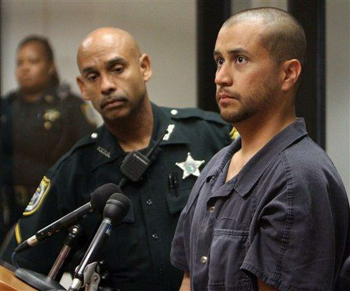 In this April file photo, George Zimmerman, charged with killing 17-year-old Trayvon Martin, right, stands next to a Seminole County Deputy during a court hearing in Sanford, Fla. Associated Press