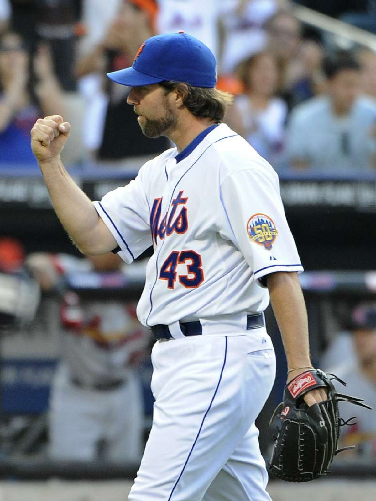 ASSOCIATED PRESS New York Mets starting pitcher R.A. Dickey pumps his fist after the Mets shut out the St. Louis Cardinals 5-0 Saturday at Citi Field in New York.