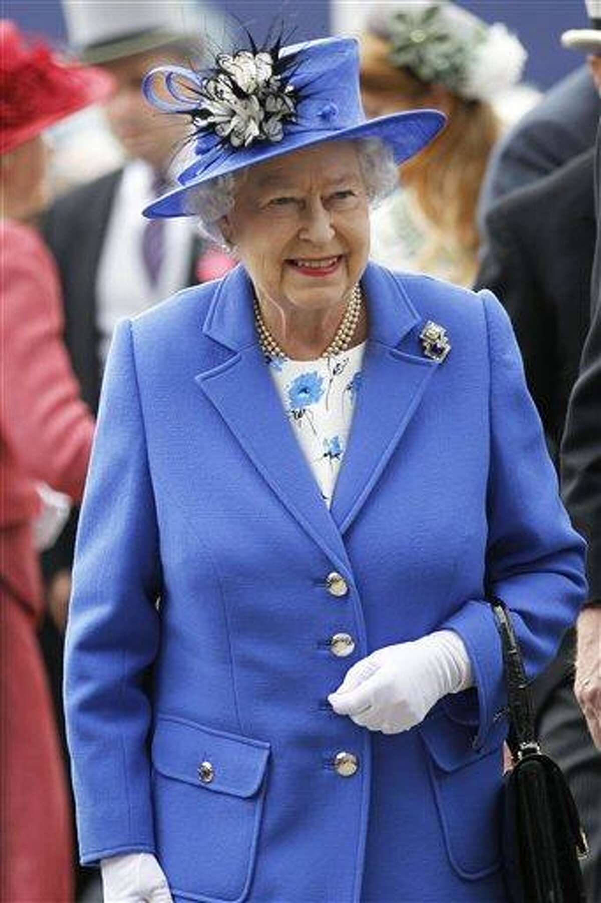 Britain's Queen Elizabeth II arrives for the Epsom Derby at Epsom race course, southern England at the start of a four-day Diamond Jubilee celebration to mark the 60th anniversary of the Queen's accession to the throne Saturday, June 2, 2012. The queen will celebrate Saturday at the Epsom Derby, a highlight of the horseracing calendar, and on Sunday she will lead a 1,000-boat flotilla on the River Thames. Monday's festivities include a pop concert in front of Buckingham Palace with Paul McCartney and Elton John, and festivities climax Tuesday with a religious service, a procession through the streets of London and the royal family's appearance on the palace balcony. (AP Photo/Sang Tan)