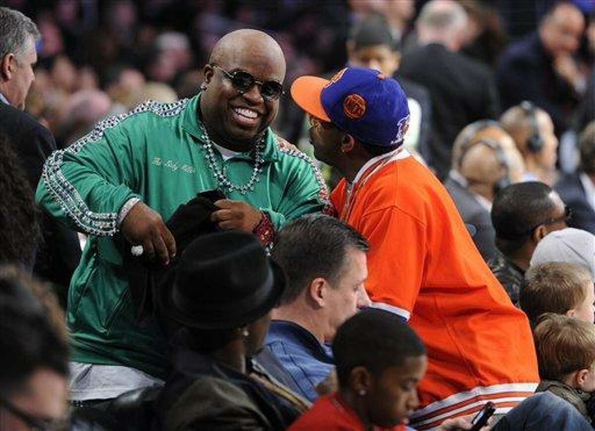 Cee Lo Green, left, has a talk with Spike Lee at the NBA basketball All-Star weekend, on Saturday, Feb. 19, 2011, in Los Angeles.