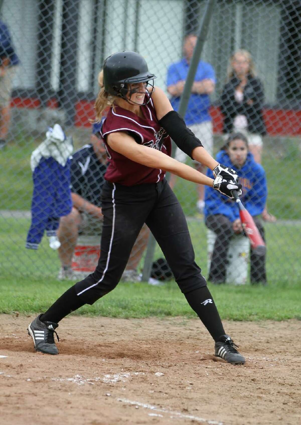 MARIANNE KILLACKEY/Register Citizen Correspondent Torrington's Sydney Matzko follows through on her RBI triple during the bottom of the sixth inning of Friday afternoon's Class L softball quarterfinal game against Brookfield at Torrington High School. The Lady Raiders lost 5-1. Torrington ended its season with a program-best 21-4 record.