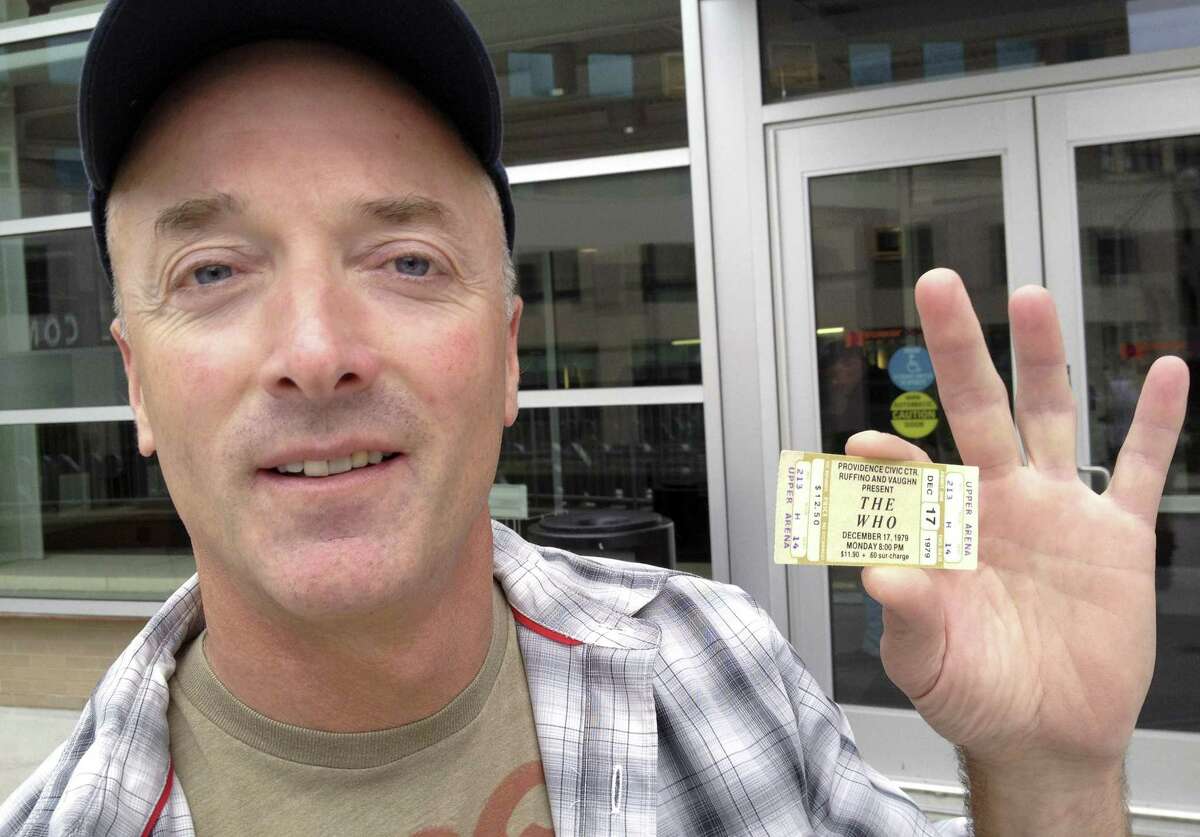 Emery Lucier, 50, of Milford, Mass., holds a ticket for a canceled-1979 concert by The Who outside the Dunkin Donuts Center in Providence, R.I., Tuesday, July 31, 2012. Lucier was among fans who redeemed tickets from a canceled 1979 show, for The Who's Quadrophenia show set to play there in February 2013. Their 1979 concert was cancelled due to safety concerns after 11 people died in a stampede before a show in Ohio. (AP Photo/Michelle R. Smith)