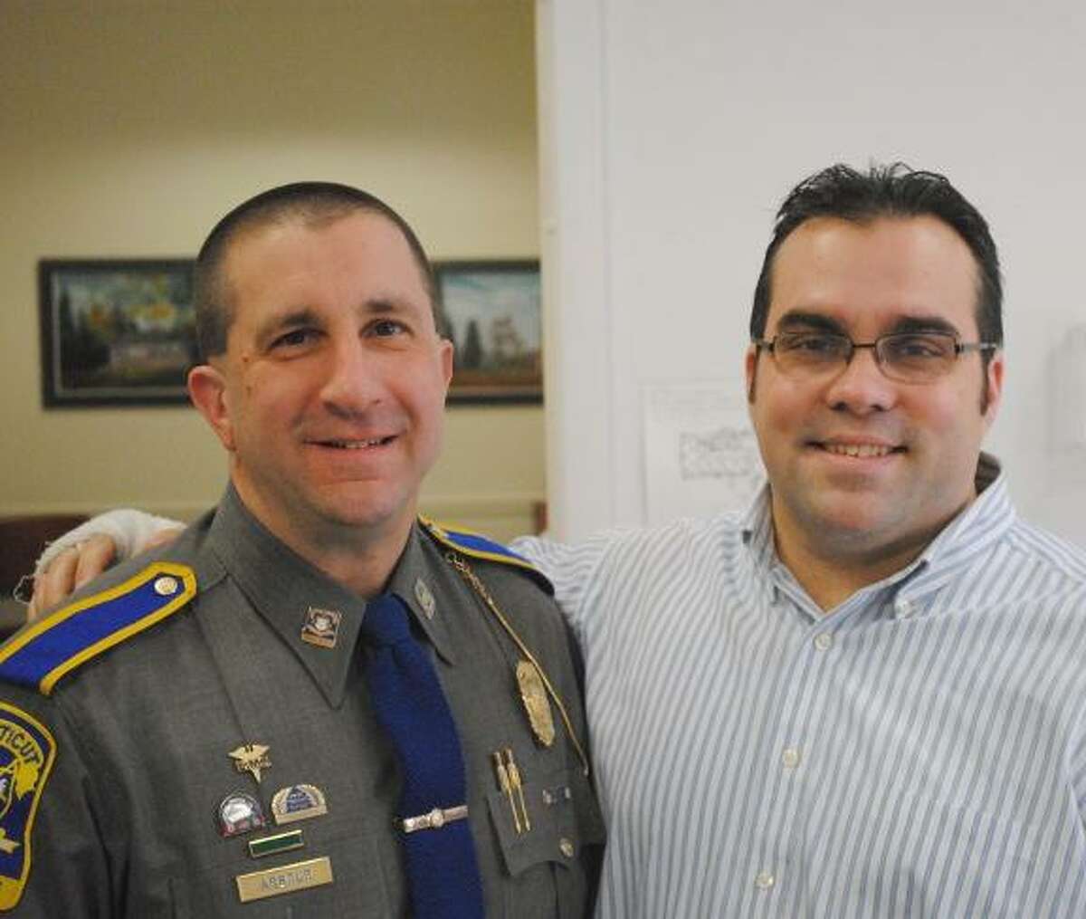 MIKE AGOGLIATI/Register Citizen Harwinton Resident Trooper Bill Arbour, left, was welcomed to the job by First Selectman Michael Criss last week.