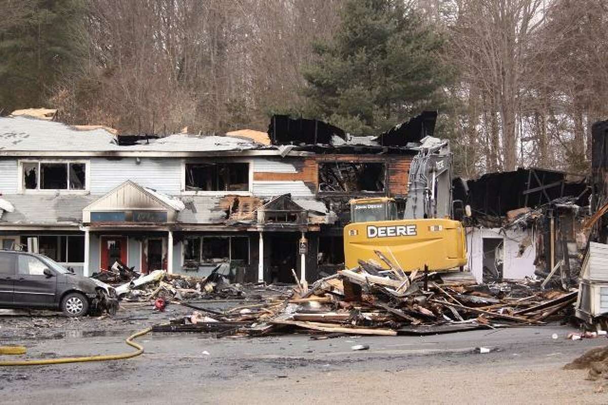 A partially collapsed building destroyed by an early morning fire in Southbury; photo by Walter Kidd.