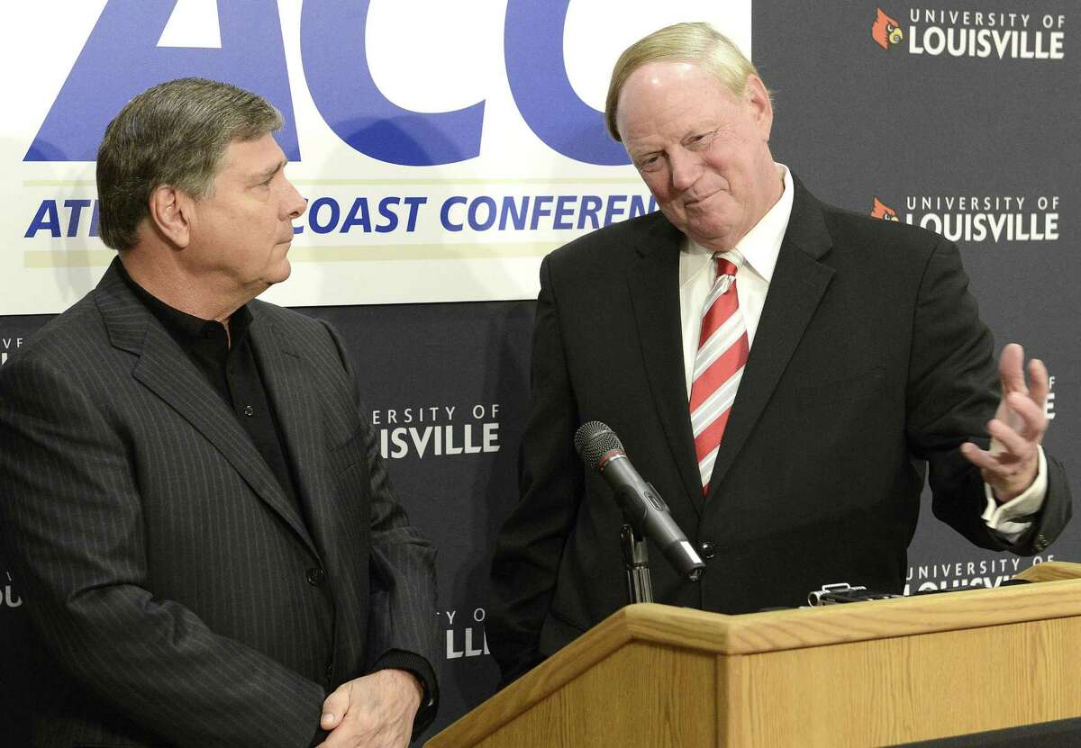 University of Louisville President Dr. James Ramsay, right, and Louisville Athletic Director Tom Jurich field questions during a news conference, Wednesday, Nov. 28, 2012, in Louisville, Ky., announcing that the university is joining the Atlantic Coast Conference