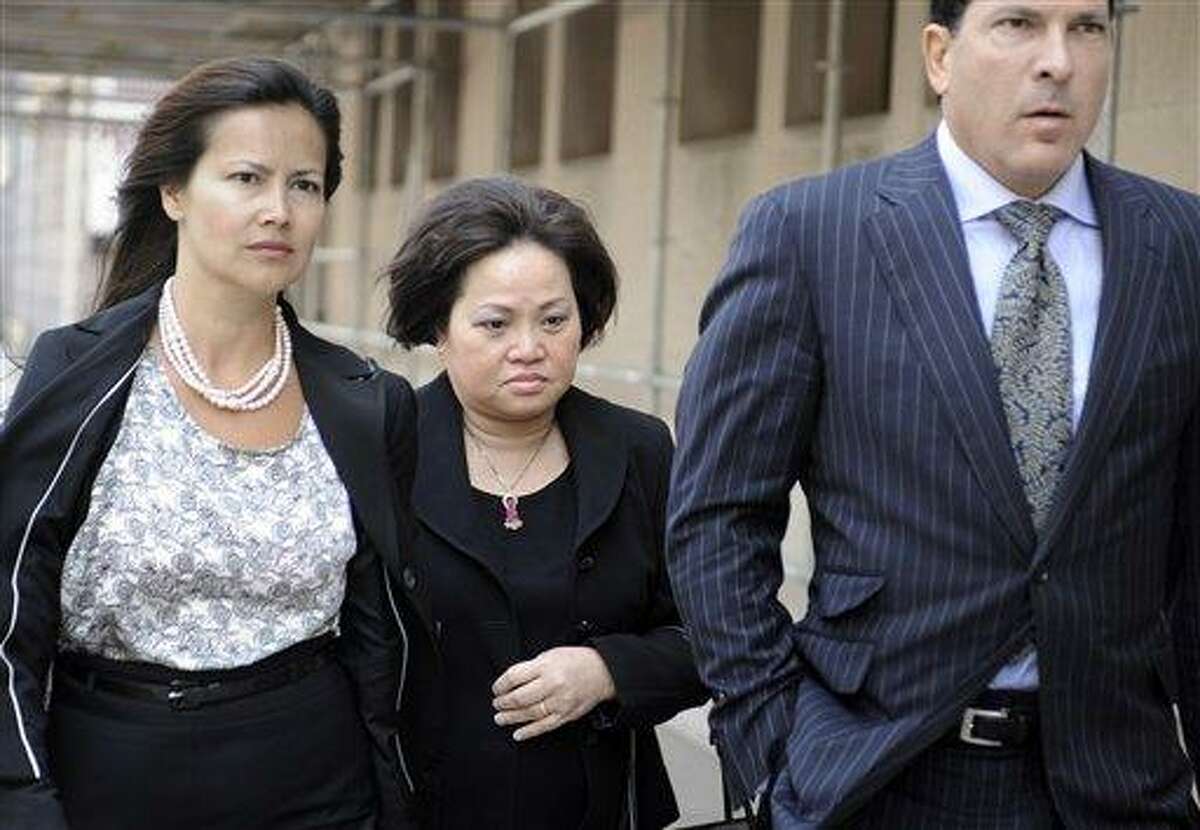 Vivian Van Le, mother of Annie Le, center walks with Joseph Tacopina, attorney for the Le family, right, and an unidentified woman, left, outside Superior Court in New Haven, Conn., Friday, June 3, 2011. Raymond Clark III is being sentenced in the murder and attempted sexual assault in the strangling of 24-year-old Yale University graduate student Annie Le of Placerville, Calif. Le's body was found behind a lab wall on Sept. 13, 2009, five days after she was last seen inside the medical building. It would have been her wedding day. (AP Photo/Jessica Hill)