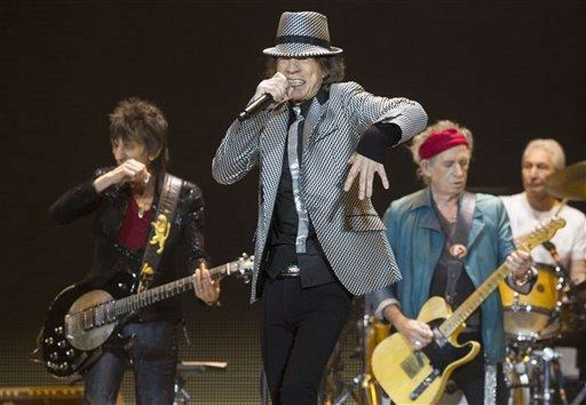 Mick Jagger, center, Keith Richards, Ronnie Wood, left, and Charlie Watts, right, of The Rolling Stones perform at the O2 arena in east London, Sunday. Photo by Joel Ryan/Invision