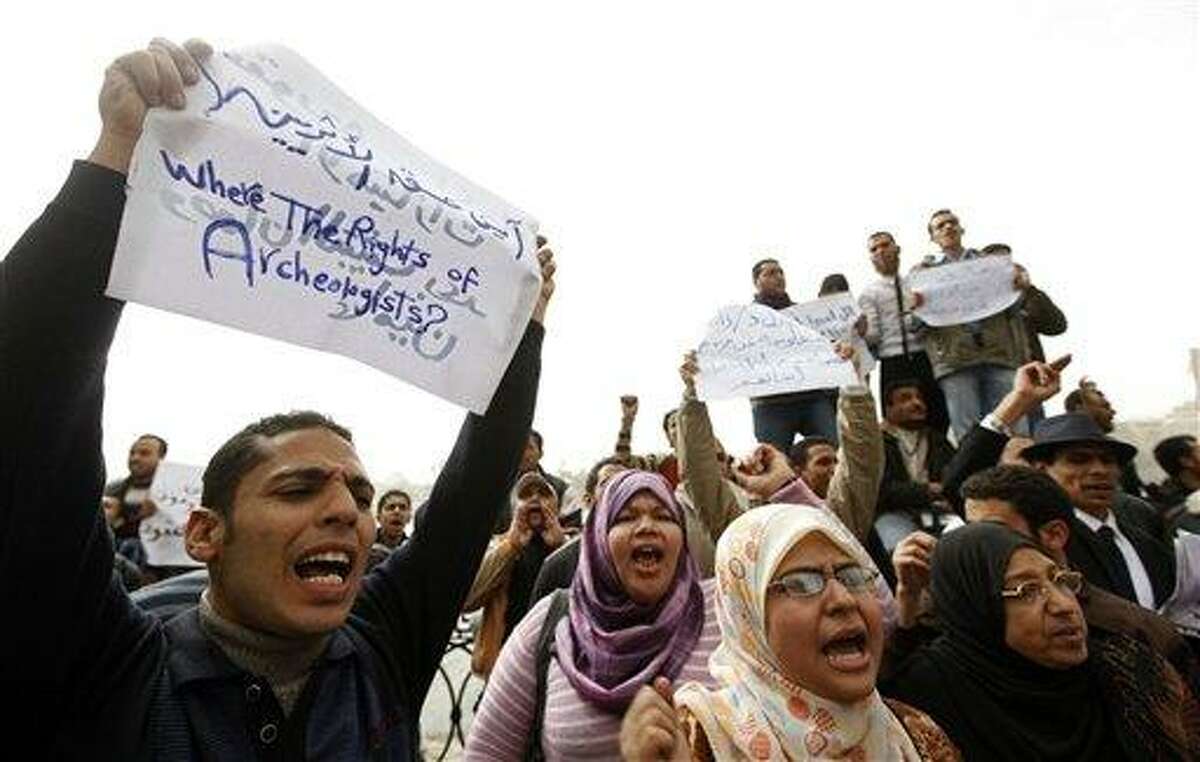 Jobless archeology graduates protest in demand of jobs in the Egyptian museum, in Cairo, Egypt, Wednesday Feb. 16, 2011. Labor unrest unleashed by the ousting of Hosni Mubarak flared again Wednesday in Egypt despite a warning by the ruling military that protests and strikes were hampering efforts to improve the economy and return life to normal.(AP Photo/Hussein Malla)