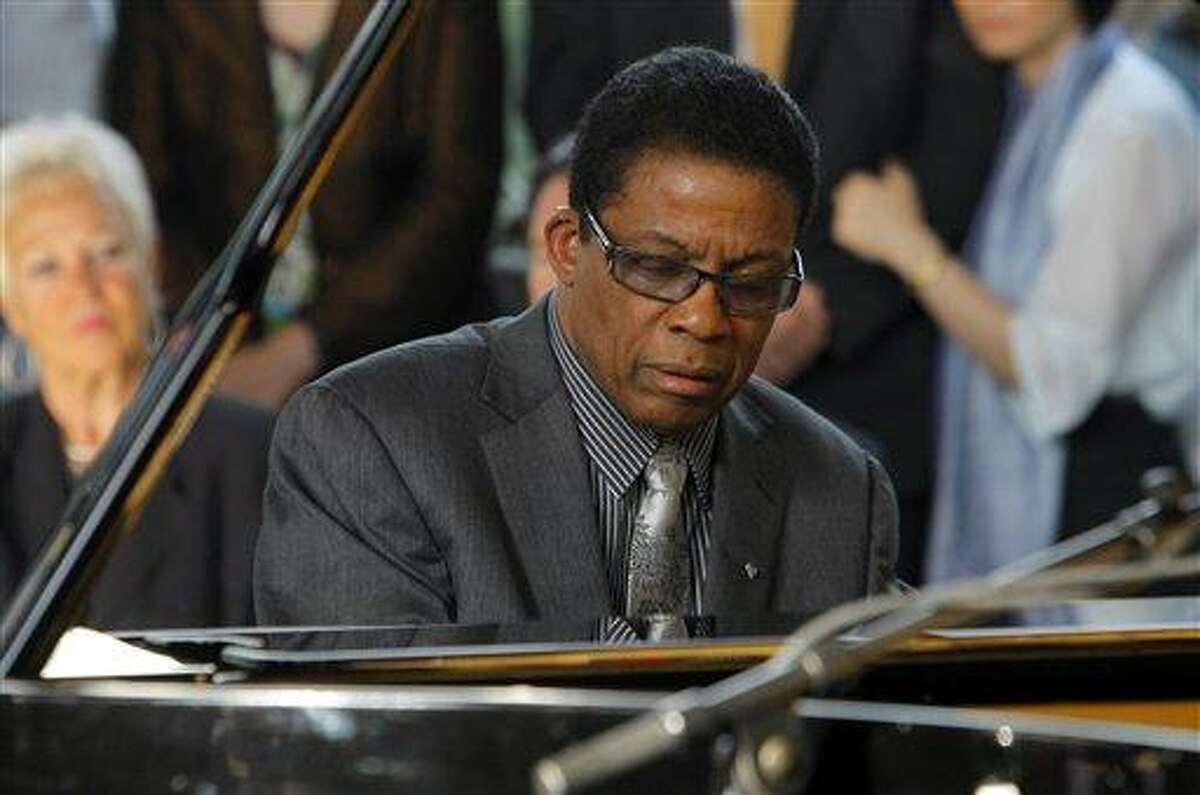 US Jazzman Herbert Jeffrey "Herbie" Hancock, plays the piano during the ceremony for his new role as a UNESCO Goodwill Ambassador, at the UNESCO headquarters, in Paris, Friday, July 22, 2011. (AP Photo/Jacques Brinon)