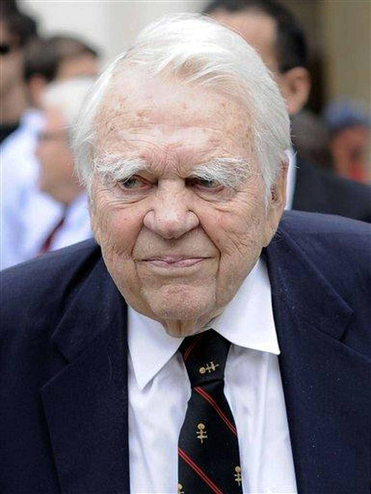 In this Aug. 9, 2009 file photo, 60 Minutes' Andy Rooney, center leaves the Celebration of Life Memorial ceremony for Walter Cronkite at Avery Fisher Hall in New York. CBS says former "60 Minutes" commentator Andy Rooney died Friday, Nov. 4, 2011 at age 92.