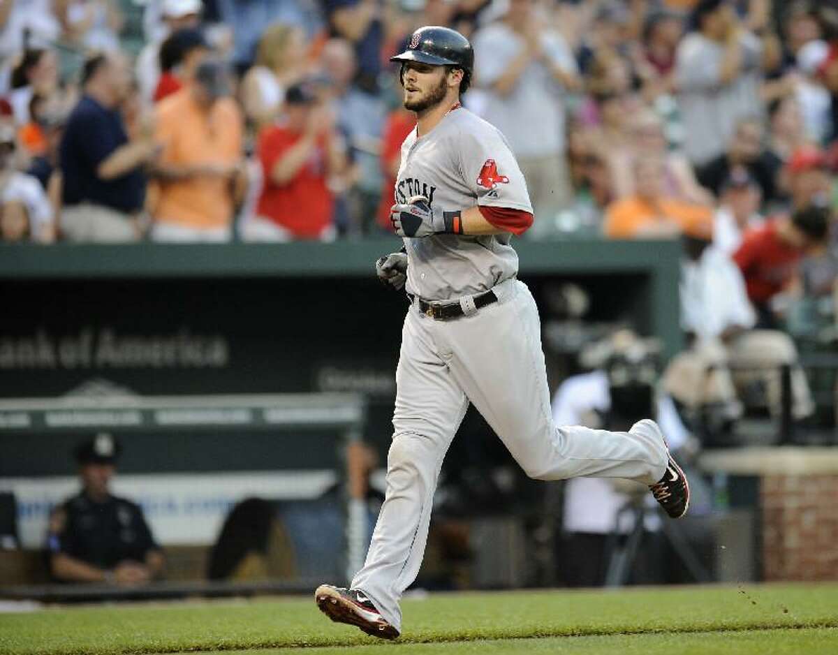 ASSOCIATED PRESS Boston Red Sox catcher Jarrod Saltalamacchia trots home to score after he hit a home run against the Baltimore Orioles during the third inning of Monday's game in Baltimore. The Red Sox won 15-10.