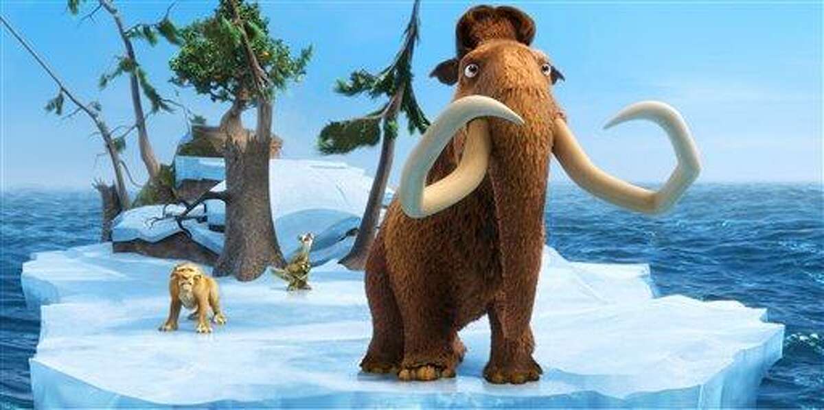 This image released by 20th Century Fox shows the characters Diego, voiced by Denis Leary, left, Sid, voiced by John Leguizamo and Manny, voiced by Ray Romano in a scene from the animated film, "Ice Age: Continental Drift." (AP Photo/20th Century Fox)